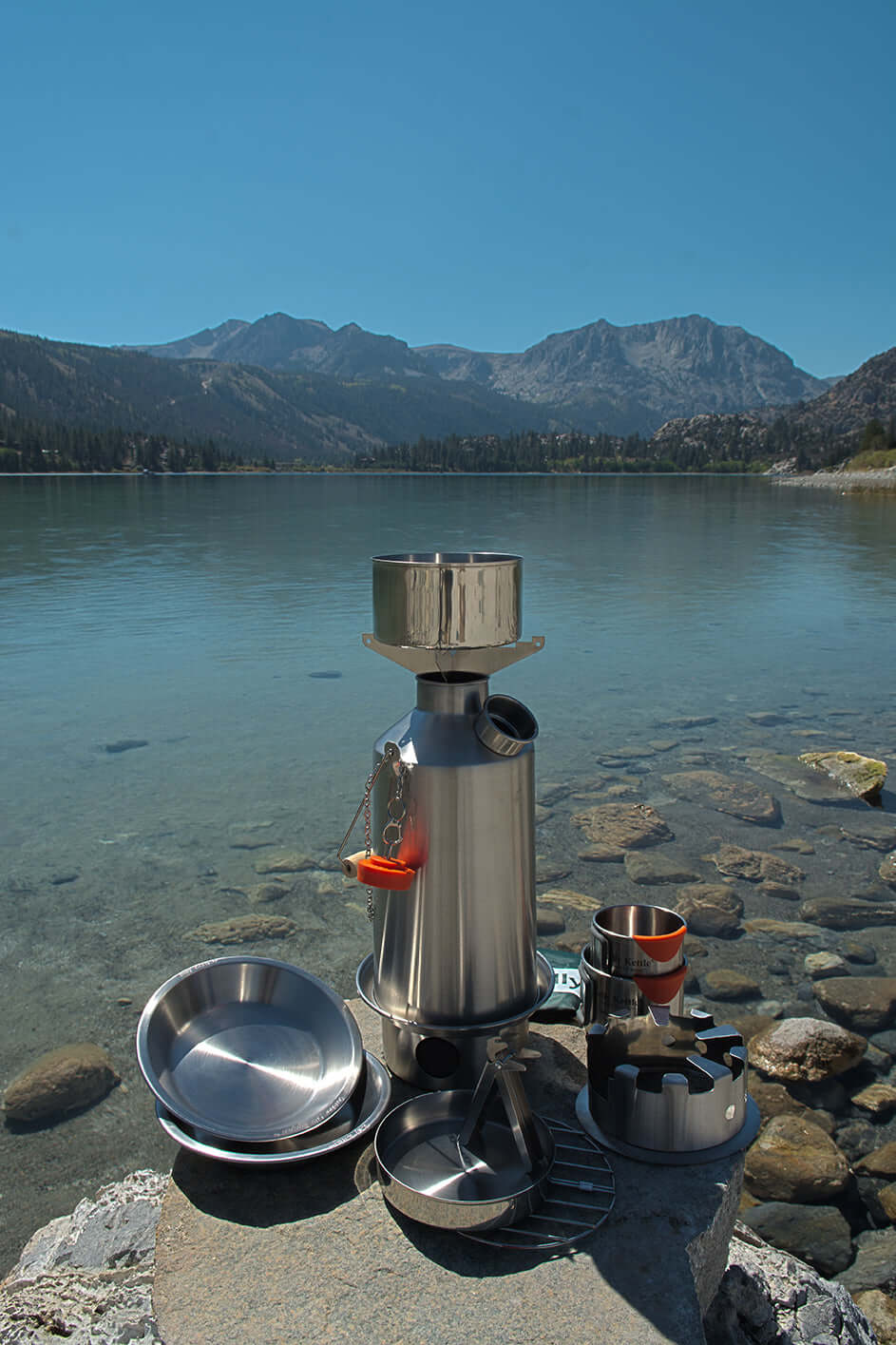 Kelly Kettle Basecamp Ultimate Kit 1.6L stainless steel camping kettle with cookset and accessories ouside
